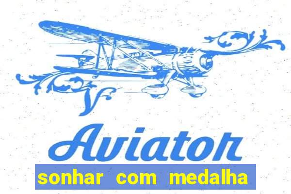 sonhar com medalha de santo